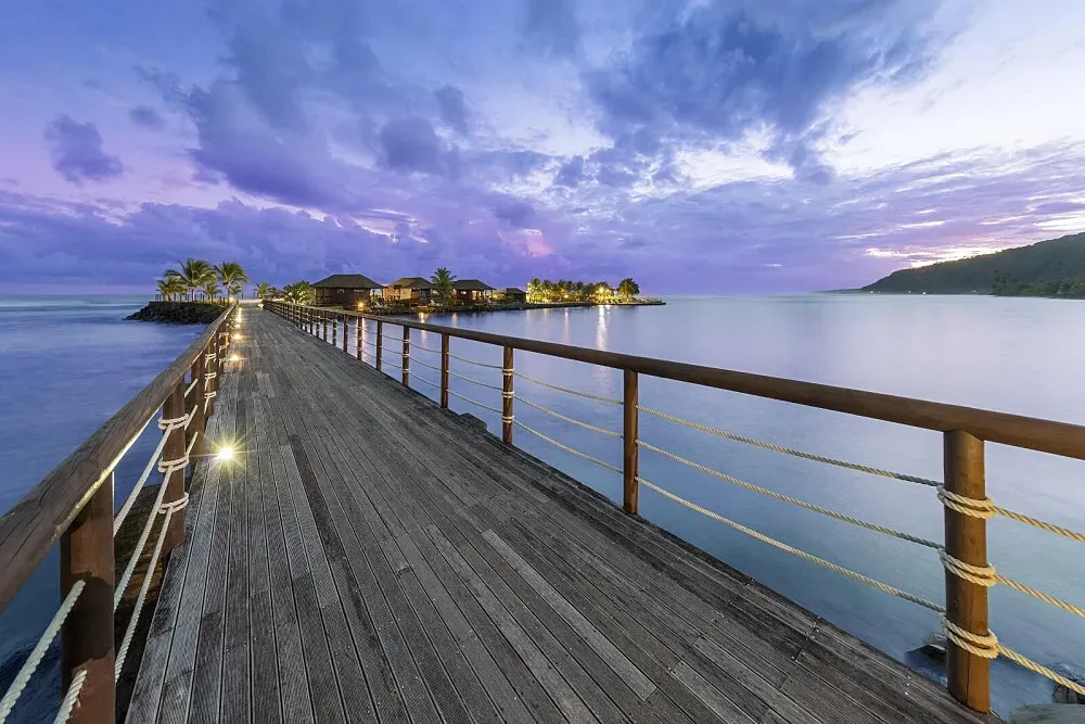Aga Reef Resort — The resort is set on the pristine southeast coast of Upolu, offering direct access to turquoise ocean waters. Lush tropical gardens and swaying palm trees create a vibrant, natural atmosphere, inviting guests to relax and soak in the island's beauty.