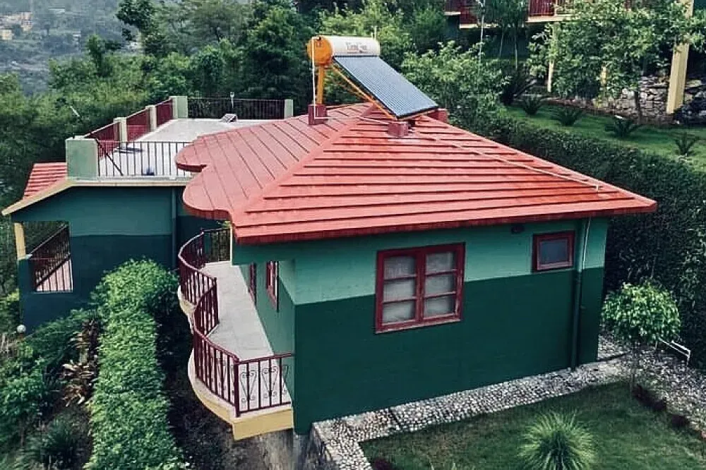 Ananda Lok — Ananda Lok is situated in Rishikesh, a location steeped in spiritual significance, particularly associated with Shiva and the Ganga River. The center is purposefully set apart from the town's intensity, offering a tranquil environment with stunning river views, surrounded by majestic mountains and verdant gardens.