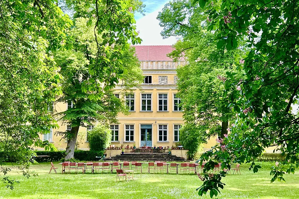 Ancestral Retreat — The retreat is situated within the serene grounds of an 1800s castle, offering a tranquil escape surrounded by nature. The historical architecture and calm environment contribute to a sense of peaceful seclusion.