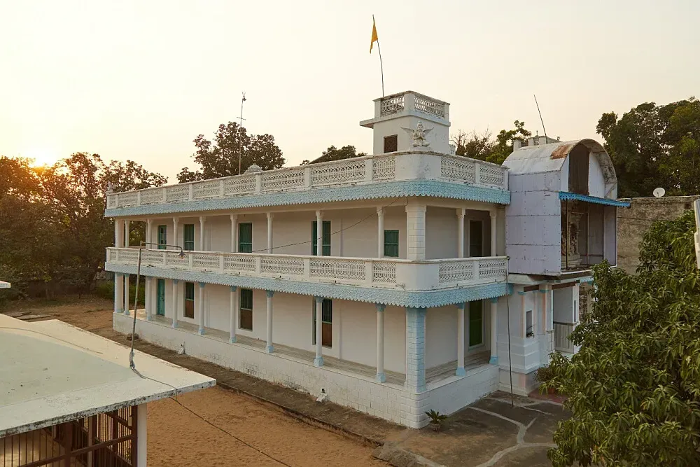 Balmukund Ashram — Pushkar is a vibrant town in Rajasthan, famous for its holy lake and Brahma temple. The ashram is situated in a quiet part of this spiritual hub, offering a serene environment amidst the town's lively atmosphere. The surrounding landscape is characterized by desert terrain and hills, providing a peaceful backdrop for reflection.