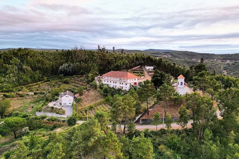 Bela Colina — Bela Colina is set in the picturesque hills of Arganil, a rural area in central Portugal. The landscape is characterized by rolling hills and natural beauty, providing a quiet and contemplative atmosphere. It's close enough to Coimbra for accessibility but sufficiently removed to offer a true sense of retreat.