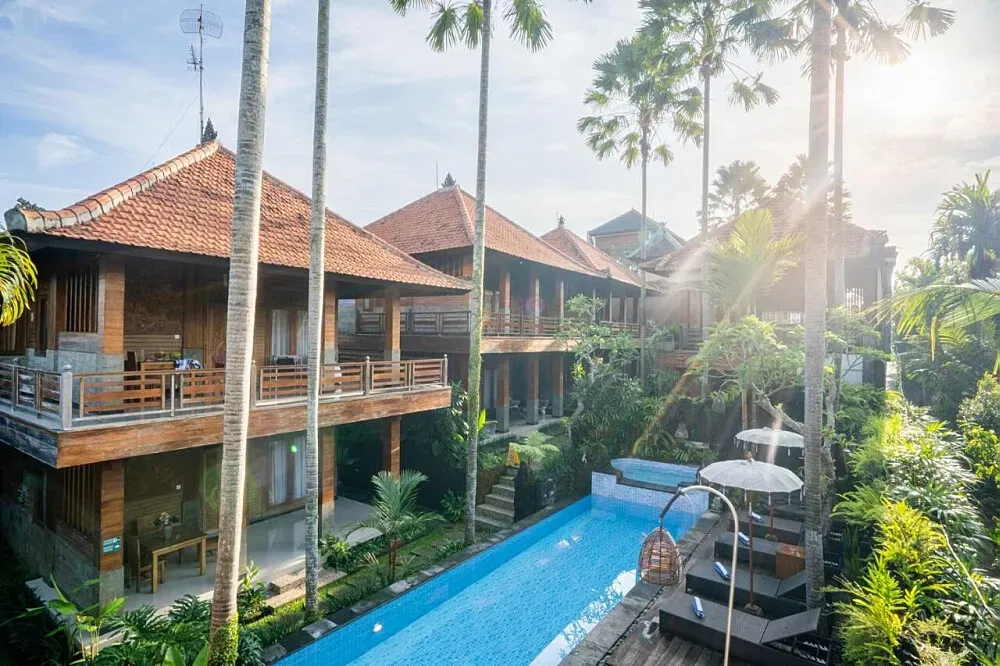 Budhi Ayu Villas Ubud — The villas are set amidst the iconic rice fields of Ubud, offering a serene and picturesque backdrop for your stay. The atmosphere is one of peaceful natural beauty, with the gentle sounds of the Balinese countryside creating a calming environment.