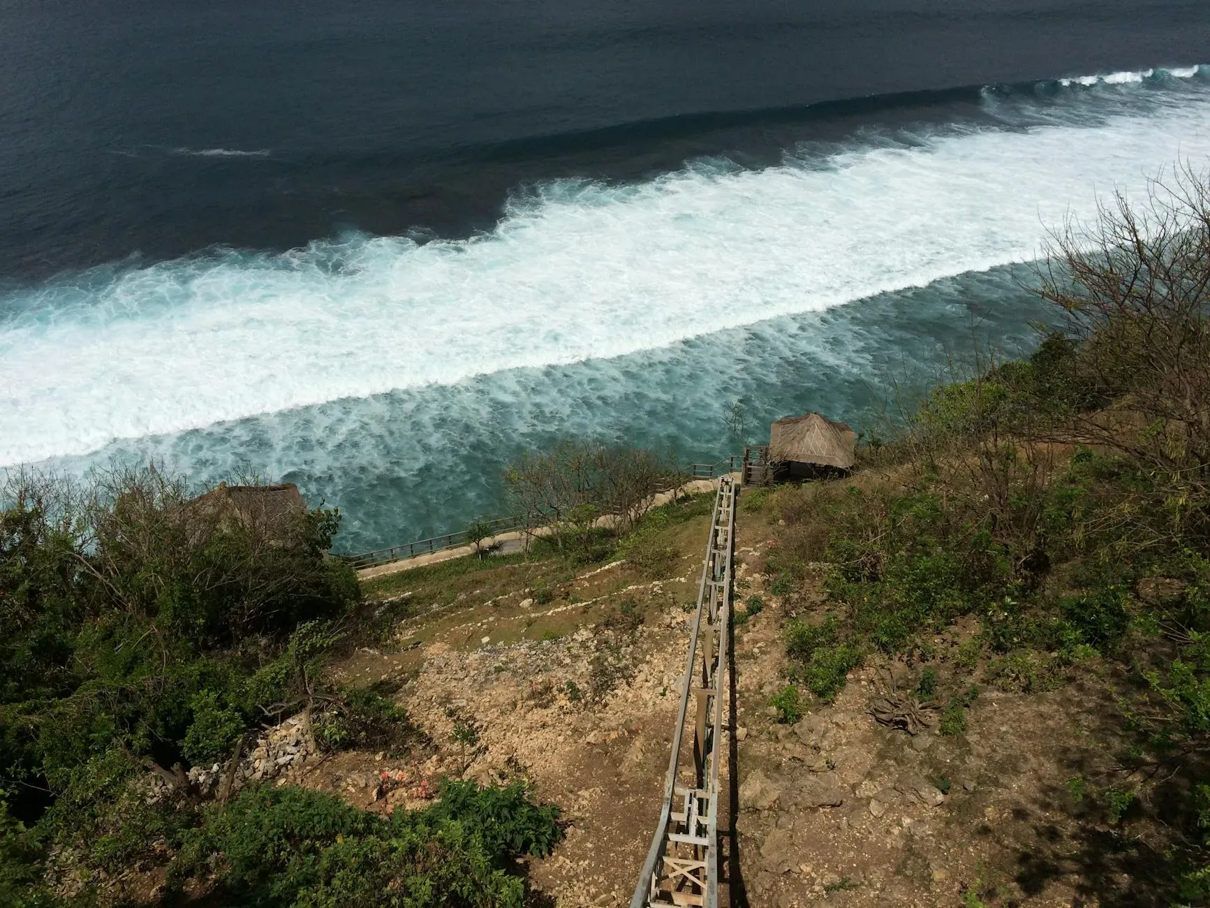 Bumi Cinta — The center is dramatically situated atop the ridges of the Les valley, providing expansive and breathtaking views of the Bali Sea merging with the sky. The surrounding landscape is lush and serene, creating an immersive natural environment.