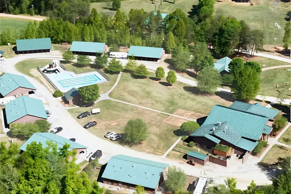 Camp Harrison YMCA — Camp Harrison YMCA is situated within the picturesque Brushy Mountains of North Carolina. The sprawling 2,000-acre property is a natural haven, featuring dense woods, meandering streams, and beautiful waterfalls. Numerous trails crisscross the landscape, inviting guests to explore the serene environment and immerse themselves in the tranquility of nature.