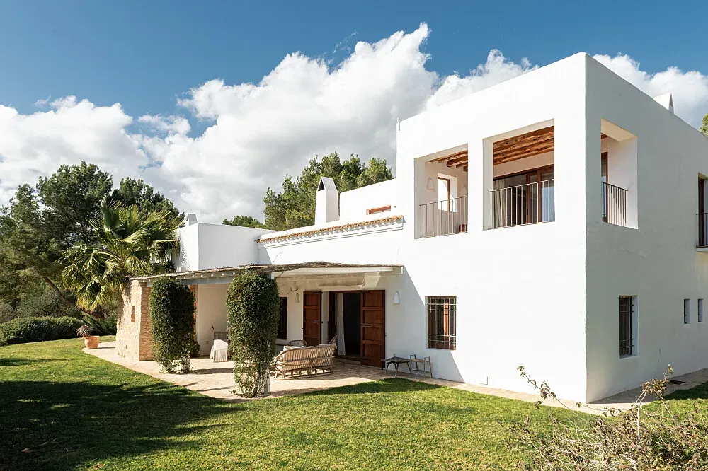 Can Ada — The retreat is set within acres of private lands and gardens, providing a tranquil and expansive environment. The property includes an infinity saltwater swimming pool and dedicated yoga lawn, all designed to foster relaxation and connection with nature.