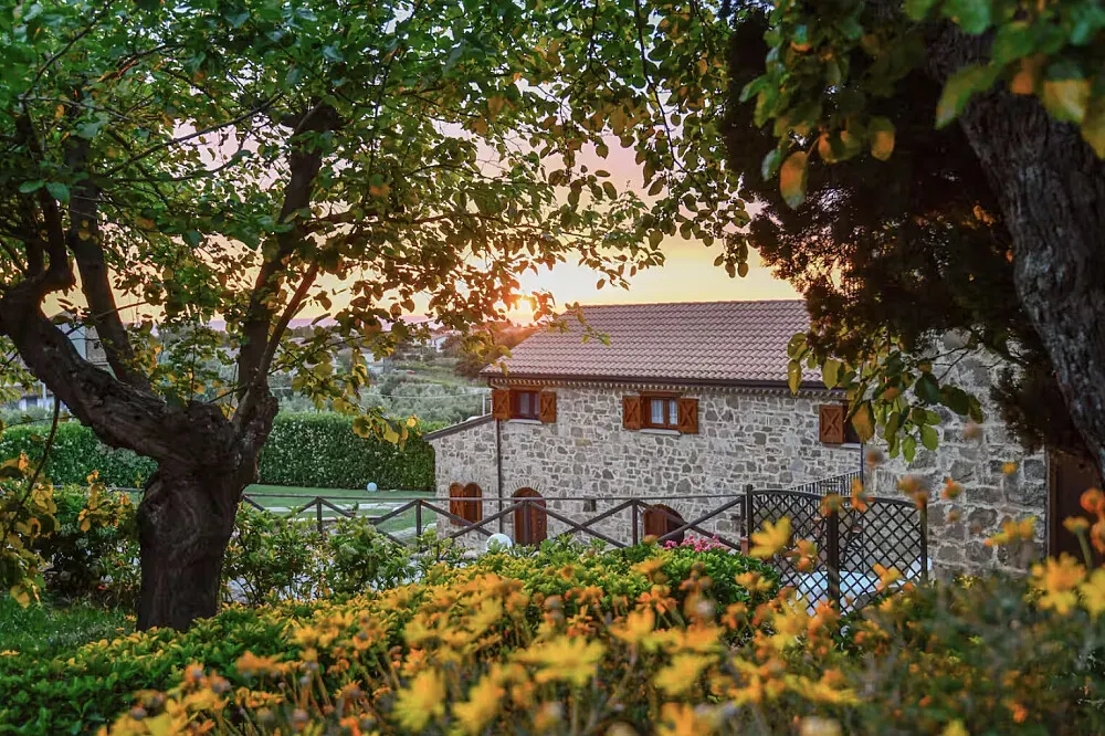 Casale il Saùco, — The center is situated in a 14th-century stone farmhouse, surrounded by olive groves in the Cilento region of Italy. This area is celebrated as a Blue Zone, characterized by its Mediterranean landscape, slow pace of life, and a palpable sense of historical depth.