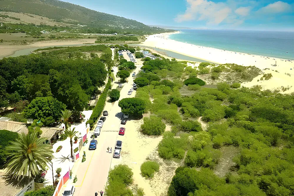 Dunas Luxury Beach Resort — set amidst the breathtaking natural beauty of the Costa de la Luz, the resort is surrounded by unspoilt landscapes. The atmosphere is one of serene luxury, where the wildness of the coast meets refined comfort, creating a tranquil escape.