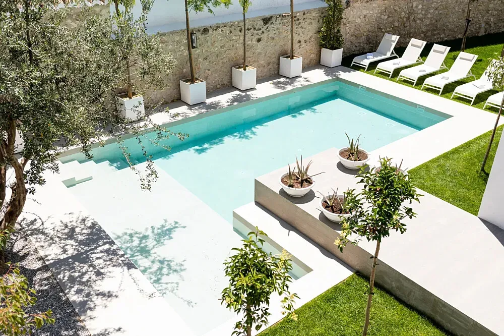 El Molino de Plata — El Molino de Plata is situated in Albuñuelas, a location that promises a tranquil rural setting. The transformation of a historic mill into a refined villa suggests an atmosphere where history and natural beauty converge, offering a peaceful backdrop for reflection and relaxation.