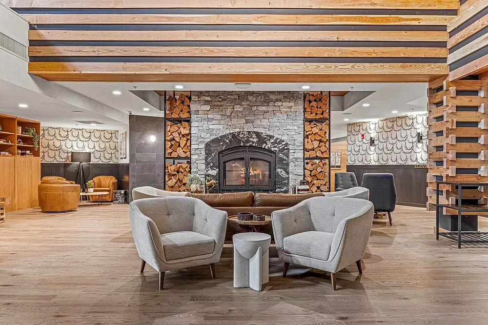 Everwild Canmore Nordic Spa and Hotel — Nestled within the Canadian Rockies, the center is surrounded by breathtaking mountain vistas. The atmosphere is one of serene natural beauty, with an emphasis on integrating the indoor experience with the outdoor landscape.