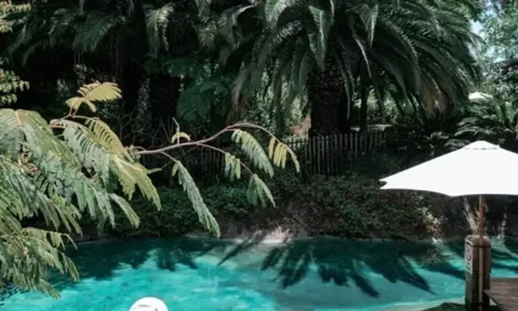 Ferguson Valley Escape — Set within 12 acres of lush tropical gardens, the venue features a natural spring-fed resort pool and many tranquil spots for relaxation. The atmosphere is one of serene natural beauty, with ample opportunities to engage with the outdoors or find quiet contemplation.