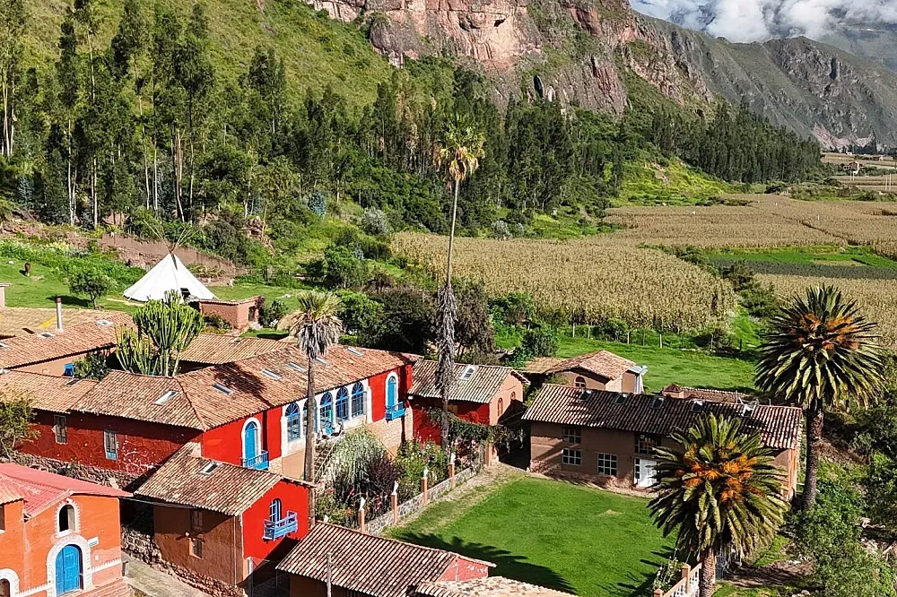 Hacienda Paucartika — The hacienda is located in the heart of the Andes, with majestic mountains and lush gardens surrounding the property. It sits beneath the ancient Incan ruins of Huchuy Qosqo, offering a deeply historical and naturally beautiful atmosphere.
