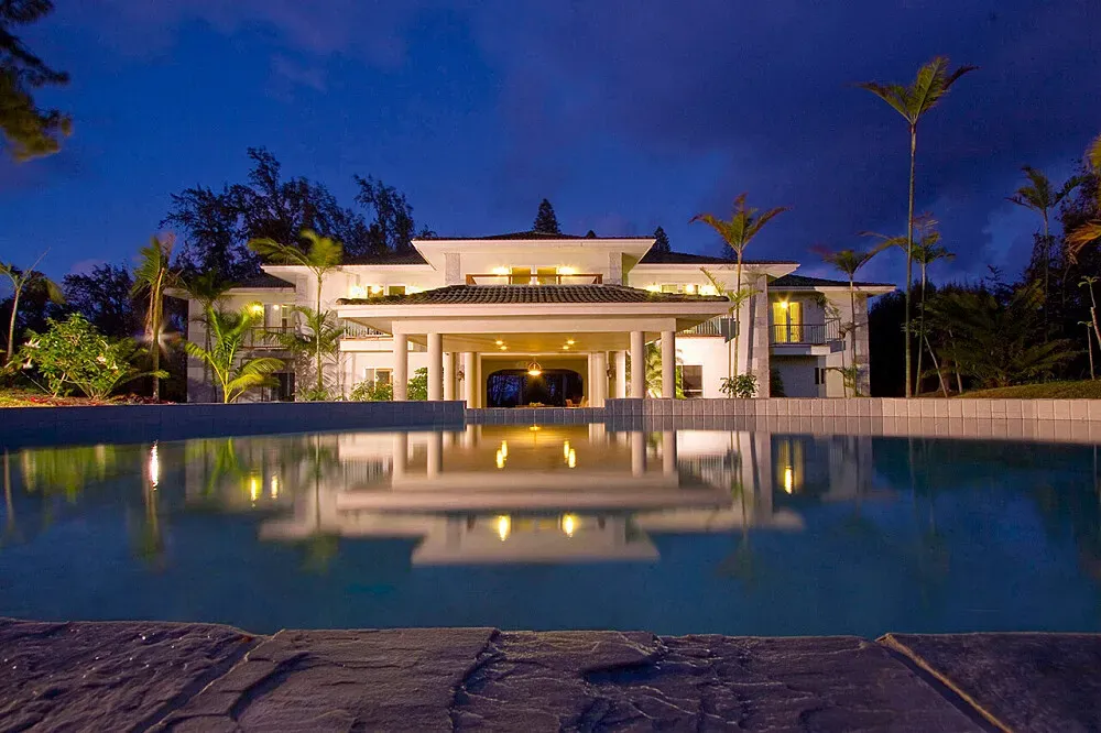 Hawaii Island Retreat — The retreat is situated on Hawaii Island's North Kohala coast, a region known for its dramatic cliffs, lush valleys, and expansive ocean views. Towering evergreens provide a verdant backdrop, while the constant ocean breezes create a refreshing and calming atmosphere. The environment is one of natural beauty and profound tranquility, well suited to quiet contemplation and relaxation.