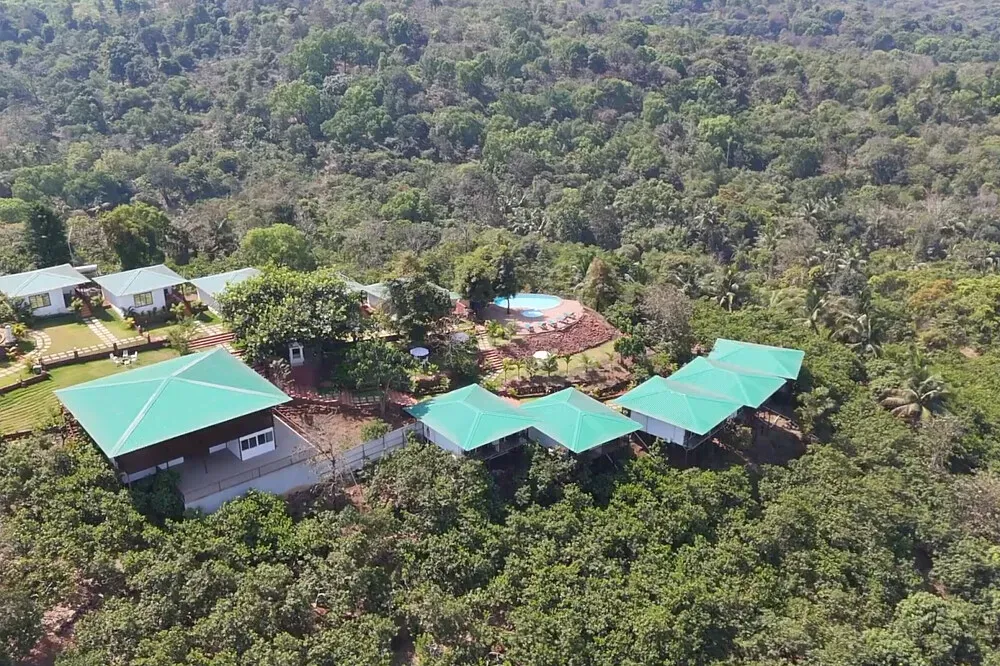Himalaya Yoga Valley Jungle Retreat — The retreat is situated amidst verdant tropical landscapes, a short drive from Goa's renowned golden beaches. It offers a secluded and private environment, yet remains conveniently close to the lively village of Arambol and the more tranquil Mandrem, both just ten minutes away by car. The property itself is a private resort, ensuring an intimate atmosphere.