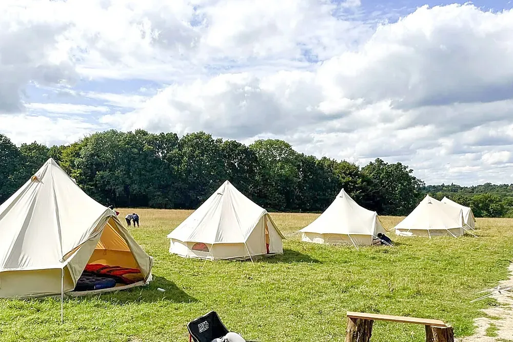 Holmstead Himalayas — Perched on a hilltop, Holmstead Himalayas is encircled by a protective ring of ancient woodland. This natural barrier not only offers shelter from the elements but also creates a secluded and peaceful atmosphere, ideal for unwinding and enjoying the outdoors. The expansive site allows for a sense of space and connection with nature.