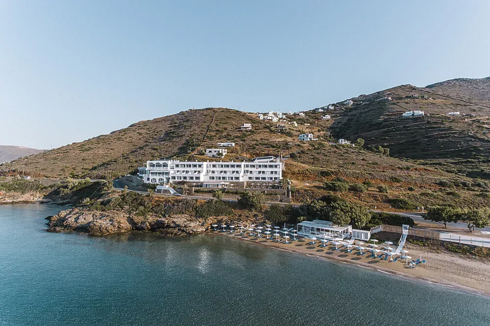 Hotel Perrakis — The hotel is situated on the beautiful island of Andros, just behind one of its most stunning beaches. The surrounding area boasts turquoise waters, pristine sands, and access to over 100 beaches, many of which are secluded. Lush landscapes are crisscrossed by numerous well-marked footpaths, offering opportunities for hiking and exploring the island's natural beauty and historical sites.