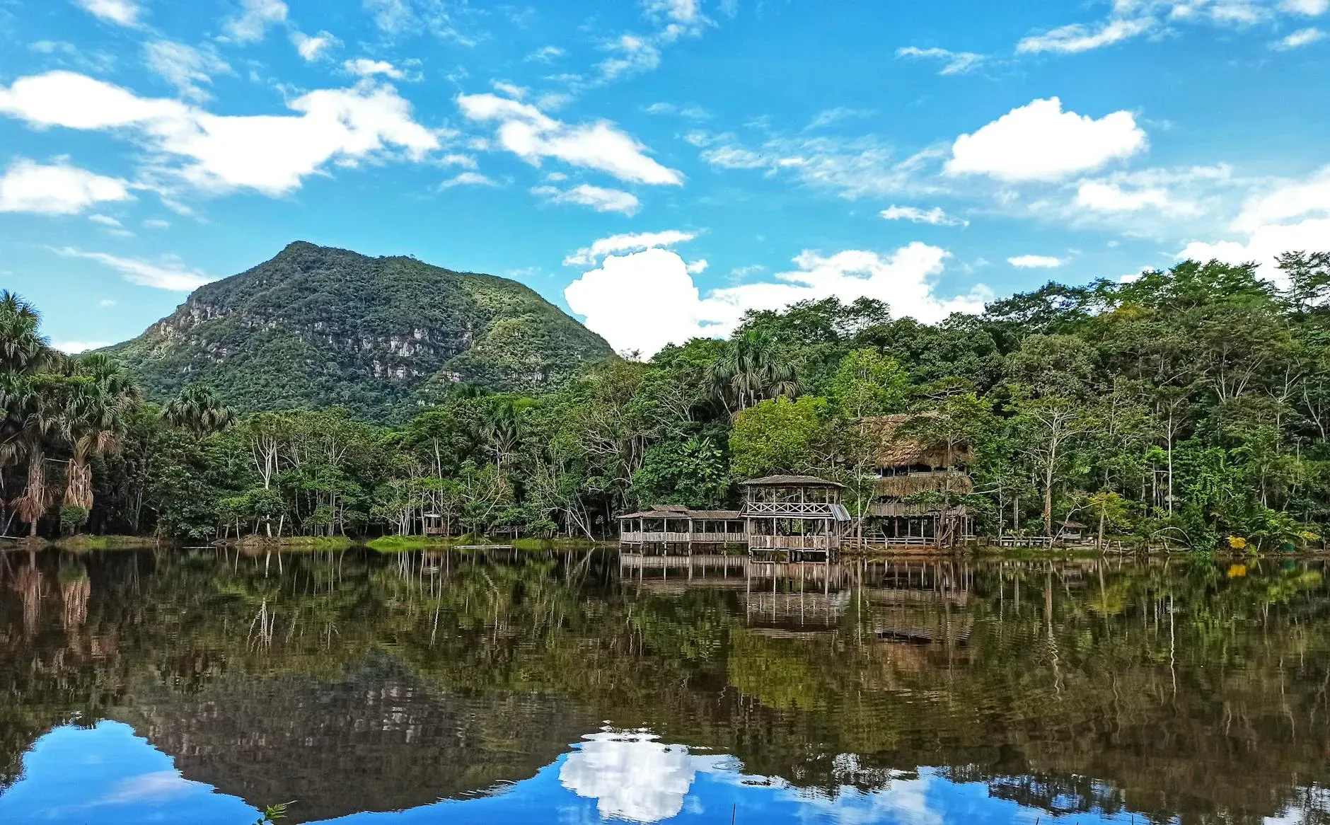 Kantu Garden Lodge — The lodge is set within the vibrant Peruvian high Amazon Jungle, providing a lush, natural backdrop for contemplation and activity. The proximity to the river offers a serene atmosphere, while the jungle sounds create an immersive experience.