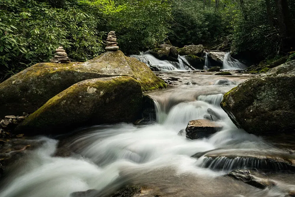 Laughing Waters — Laughing Waters is situated within the Hickory Nut Forest Eco Community, suggesting a lush, forested environment. The emphasis on environmental stewardship means visitors can expect a serene, natural atmosphere where the land is respected and cared for.