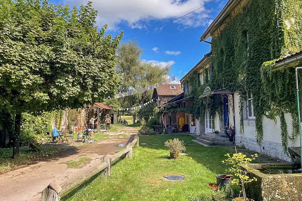 Le Moulin d'Abondance — The exact setting in France is not specified, but the cooperative nature suggests a grounded, community-oriented atmosphere, likely in a location conducive to shared living and collaborative projects.