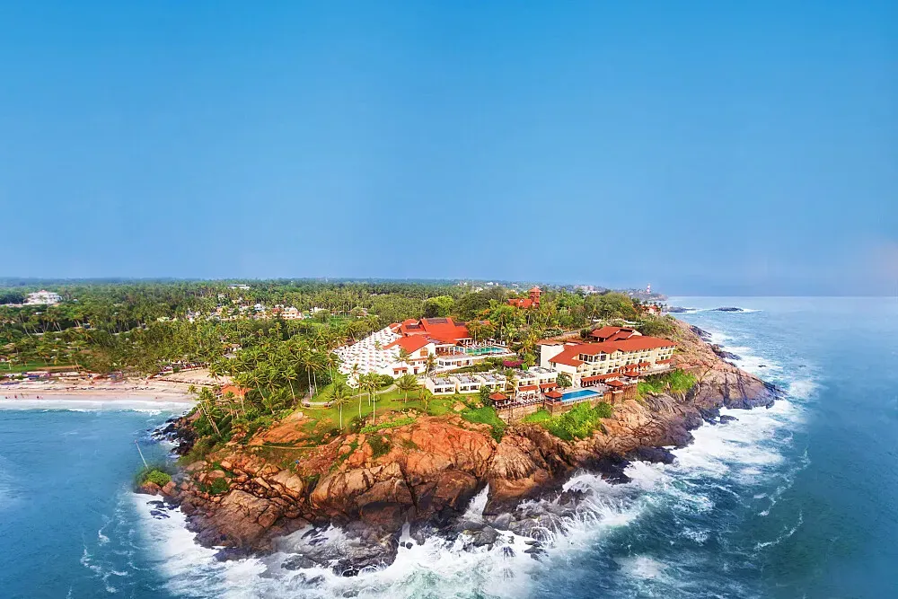 Leela Kovalam — Leela Kovalam is a waterfront property, offering guests direct views of the sea. The atmosphere is one of serene luxury, with the natural beauty of the coast complementing the resort's amenities. Imagine practicing yoga with the sound of waves as your soundtrack and the ocean stretching out before you.