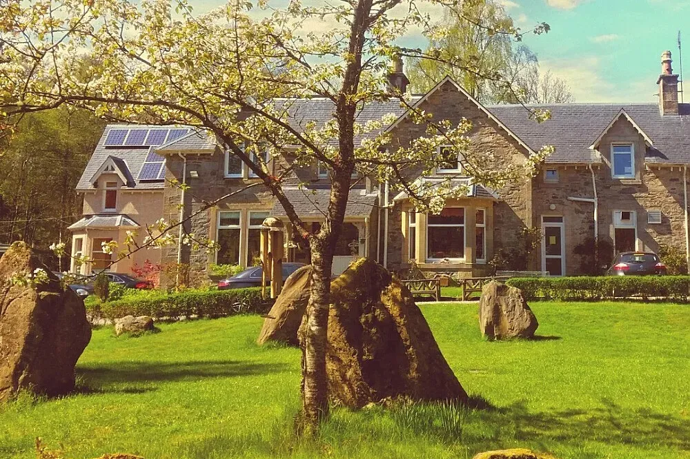 Lendrick Lodge — The center is surrounded by the dramatic beauty of the Scottish landscape, with mountains, lochs, and waterfalls offering endless opportunities for invigorating walks and a deep connection with nature. This serene environment provides a powerful backdrop for personal growth and reflection.