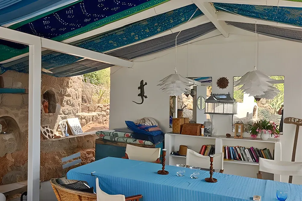 Limnisa — Limnisa is situated directly on the sea in Methana, offering immediate access to a private beach. The property boasts a lush garden with various seating areas, well suited to quiet contemplation, reading, or writing. The overall atmosphere is one of serene natural beauty and peaceful seclusion.