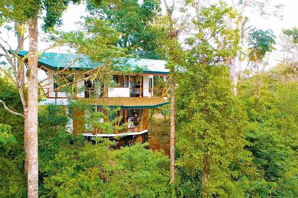 Metamorfinca — Metamorfinca is situated in San Luis, Costa Rica, about 25 minutes north of Uvita. The 22-acre property is a lush, vibrant landscape encompassing food forests, conservation areas, and a river walk, creating an immersive natural environment.