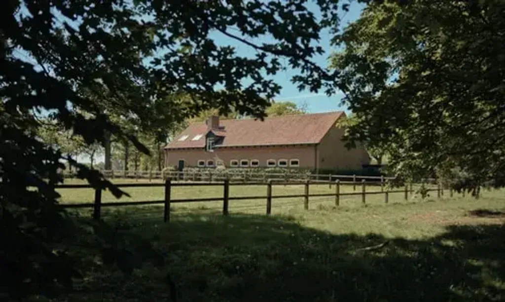 Mother's House — The retreat center is situated in the tranquil woods of Limburg, surrounded by lush meadows, woodlands, and a majestic oak tree. The property offers a serene atmosphere for quiet walks and connection with nature, providing a balance of seclusion and accessibility.