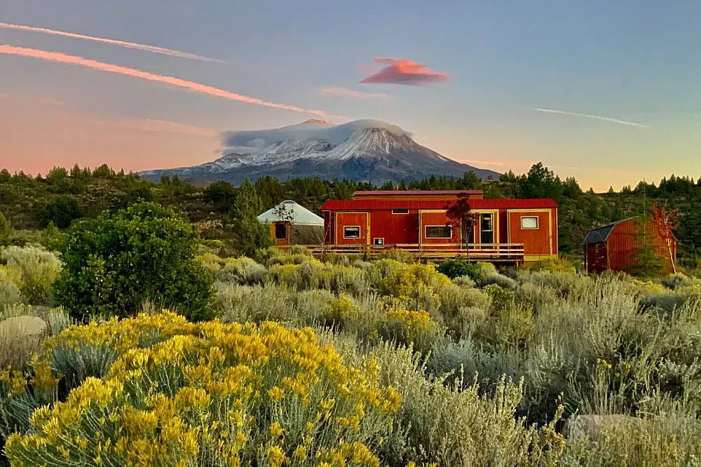 Mount Shasta Farm & Retreat House — The retreat is set in the scenic Shasta Valley, with the main house offering expansive views of the surrounding mountains. A short walk leads to Lake Shastina, while the nearby 40-acre farm provides a more secluded natural environment with private trails through native flora like juniper, sage, and incense cedar.
