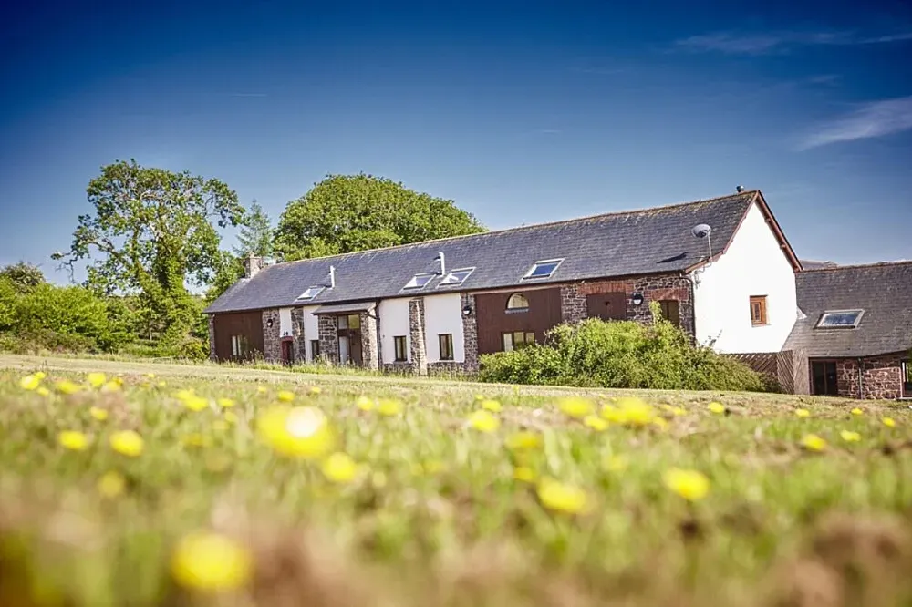 Newhouse Farm Cottages — The cottages are set amid stunning natural surroundings, providing a serene backdrop for relaxation and introspection. The atmosphere balances rustic charm with modern comforts, encouraging guests to unwind and connect with nature.