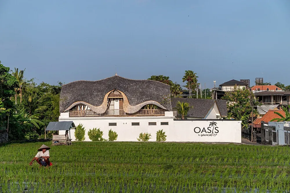 Oasis by Where's Next — The center is set amidst the iconic rice fields of Bali, offering a picturesque and tranquil environment. Lush tropical landscapes surround the property, creating a sense of peace and natural beauty. The atmosphere is one of serene escape, where the sounds of nature provide a calming backdrop to your stay.