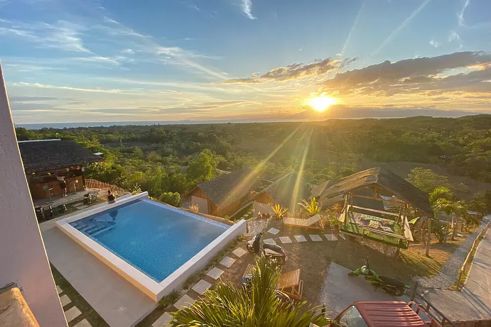 Paliton Heights Resort — The resort is situated in the quiet mountains of San Juan, offering an elevated perspective that captures expansive ocean views and lush forest. This location provides a peaceful atmosphere, ideal for those seeking a tranquil retreat while remaining accessible to local attractions.