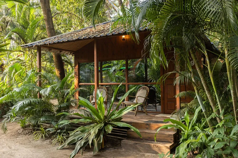 Palm Forest Boutique Beach Huts — Nestled just a short stroll from the vibrant Palolem Beach, Palm Forest provides a garden oasis that feels secluded from the main hustle. The atmosphere is one of relaxed, natural beauty, with an emphasis on connecting with the environment.