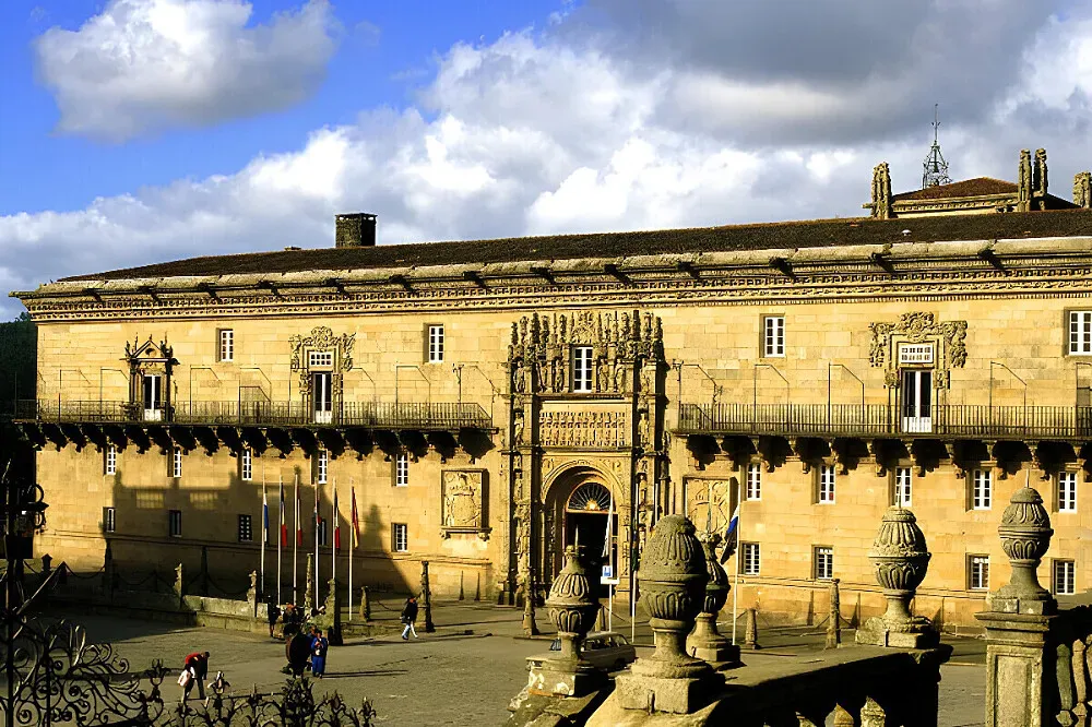 Parador de Santiago - Hostal Reis Catolicos — The center is situated in the heart of Santiago de Compostela, directly on the Plaza del Obradoiro. Its proximity to the world-renowned Cathedral of Santiago de Compostela imbues the location with a profound sense of history and spiritual significance, surrounded by the architectural grandeur of the city.