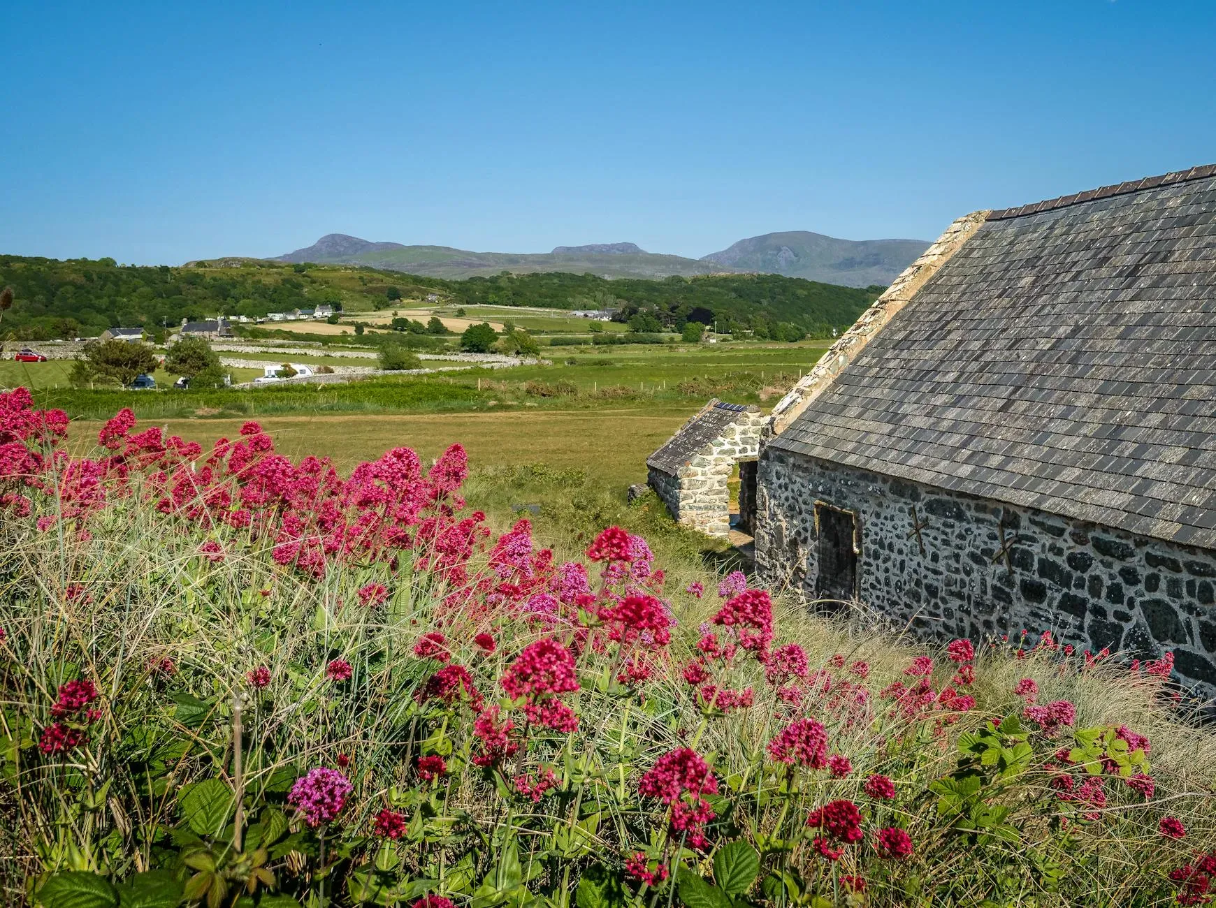 Plas Ceiriog Country Lodge — The lodge is situated in Glyn Ceiriog, a location that suggests a tranquil, rural atmosphere, likely surrounded by natural beauty conducive to relaxation and creative pursuits.