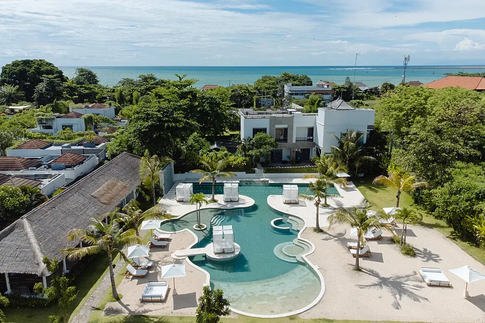 Pronoia Community Bali — Situated along six kilometers of pristine white sand on Jimbaran Beach, the center offers a tranquil coastal atmosphere. The natural environment is a key part of the experience, providing a peaceful backdrop for relaxation and rejuvenation.