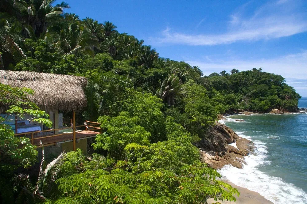 Punta Monterrey — This ecological reserve is set within a vast 300-acre jungle, providing a deeply immersive natural environment. The atmosphere is one of tranquility and community, encouraging guests to connect with both nature and each other.