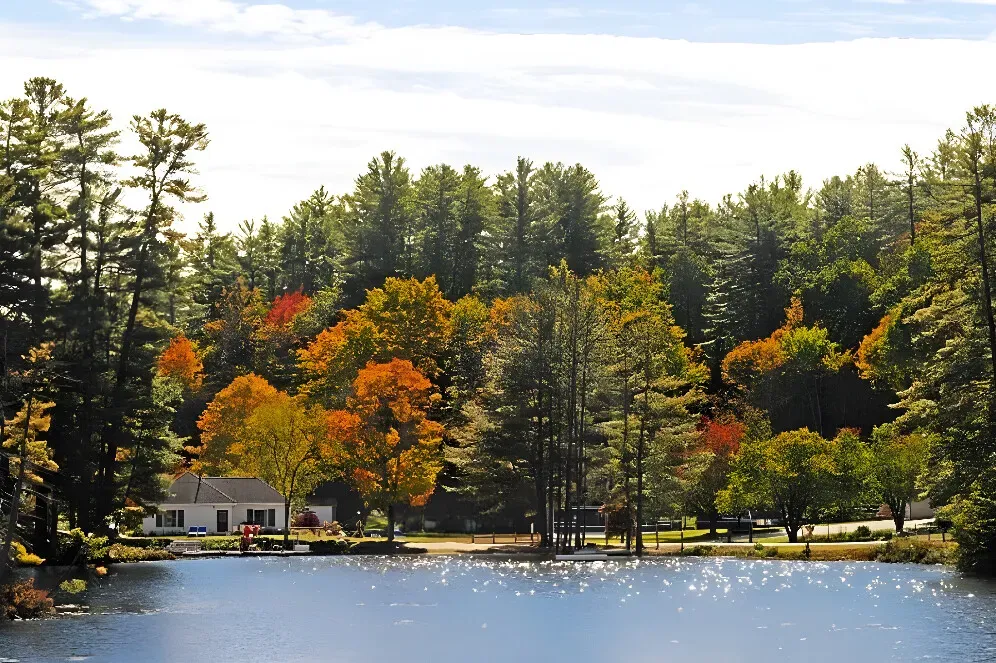 Purity Spring — The resort is situated by a lake, surrounded by the picturesque White Mountains of New Hampshire. This natural backdrop provides a peaceful and scenic environment, ideal for relaxation and outdoor activities. The atmosphere is family-friendly and geared towards a comfortable, recreational stay.