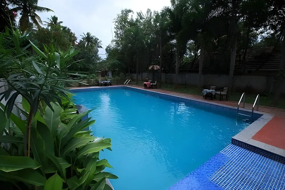 Rachana's Black Beach Resort, Varkala — The resort is situated right on the beach in Varkala, offering immediate access to the sand and sea. The atmosphere is one of laid-back coastal living, with the sounds and sights of the ocean providing a natural backdrop for relaxation.