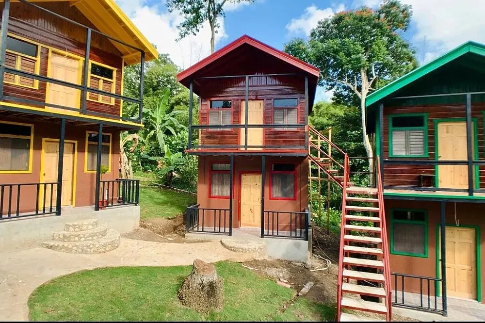 Rastafari Indigenous Village — The village is set amidst lush greenery, providing a natural and serene backdrop for cultural immersion. Expect an earthy, communal atmosphere where traditional practices and sustainable living are at the forefront.