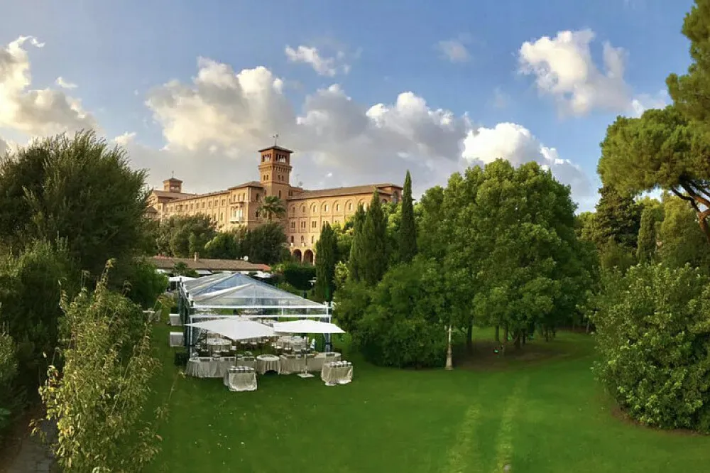 Residenza Lavernale — Perched atop the historic Aventine Hill, Residenza Lavernale is enveloped by a verdant park, creating a serene bubble in the bustling heart of Rome. The location is truly special, offering glimpses of ancient Roman treasures that glow under the streetlights at night, imbuing the surroundings with a timeless, almost magical atmosphere. It's a place where history and nature converge to offer a unique sense of calm.