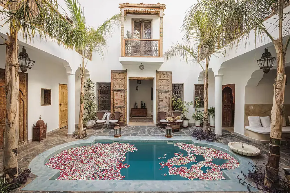 Riad Alkemia — Marrakesh is a bustling Moroccan city known for its souks, palaces, and gardens, offering a rich sensory experience.