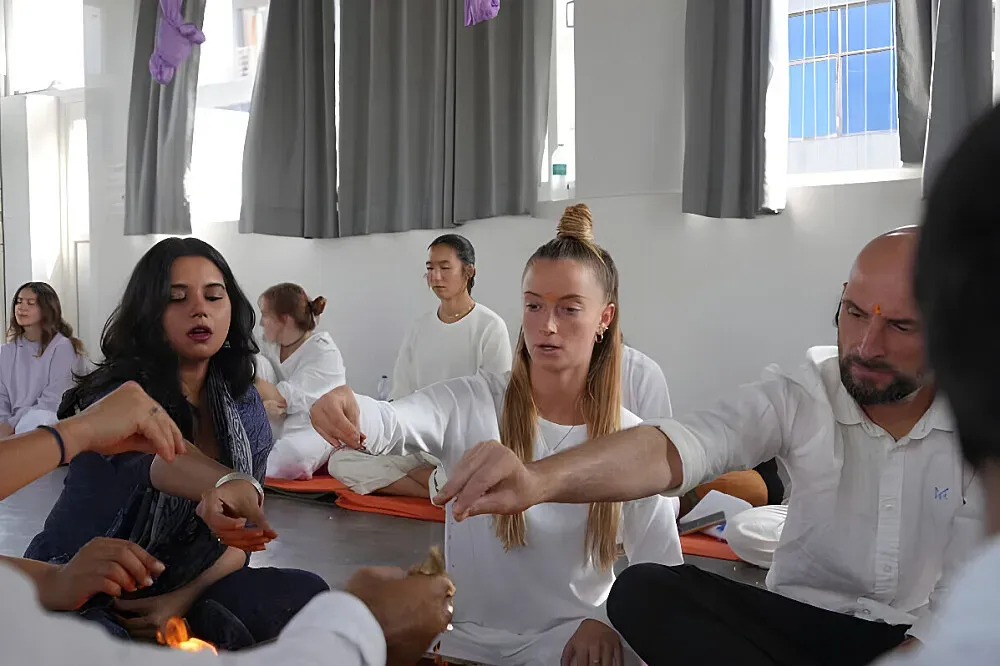 Rishikesh Yoga Valley — Rishikesh, often called the "Yoga Capital of the World," sits in the foothills of the Himalayas in northern India. The Ganges River flows through the city, adding to its serene and spiritual atmosphere. The surrounding landscape features lush green hills and the tranquil sound of the river.