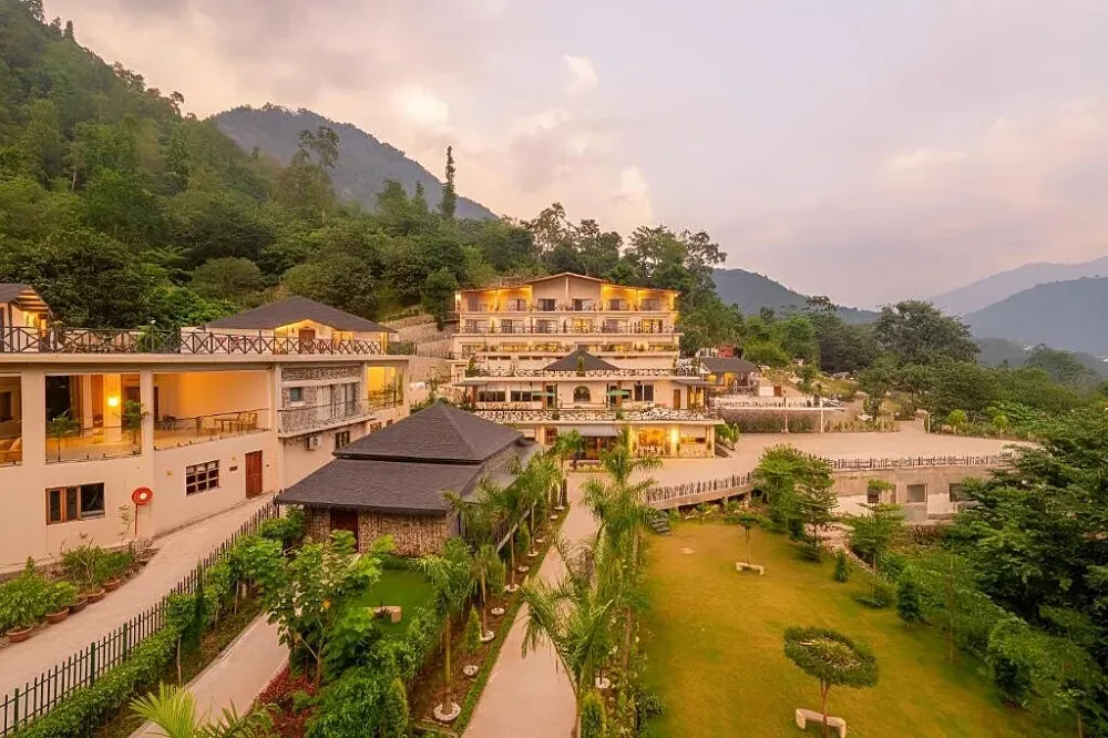 Rishivan by Orchids — The retreat is situated in the majestic hills near Rishikesh, offering breathtaking mountain views and a lush, eco-friendly environment. The atmosphere is one of tranquility and natural beauty, providing a perfect backdrop for relaxation and introspection.