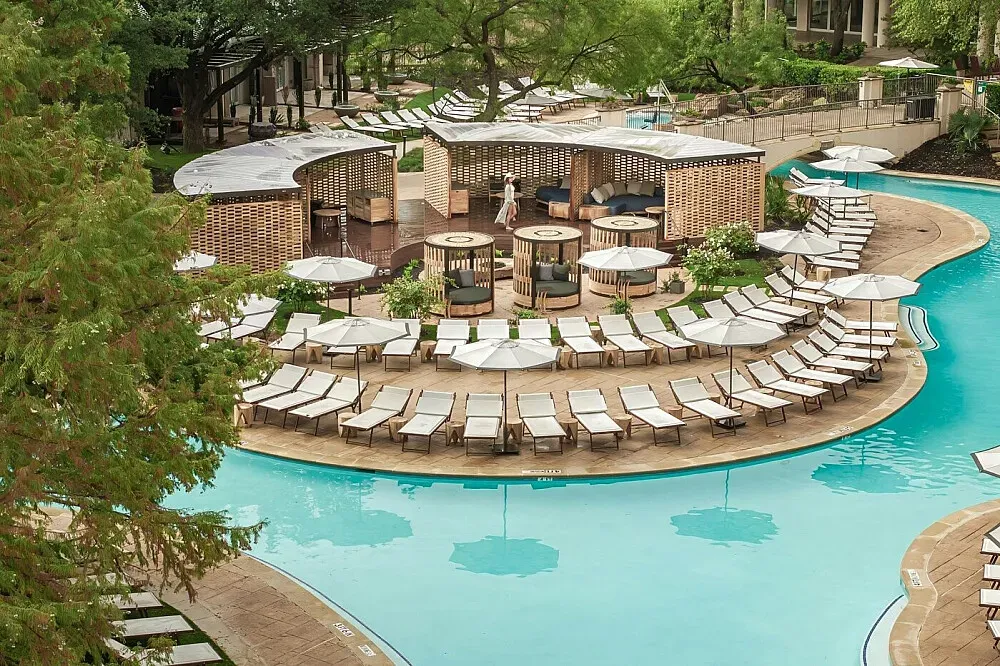 Ritz Carlton Dallas Las Colinas — The resort is set on a sprawling 400-acre estate in Las Colinas, offering a blend of manicured landscapes and upscale amenities. Expect a sophisticated atmosphere with ample space to relax and unwind, whether by the pool, on the golf course, or in one of the elegant common areas.