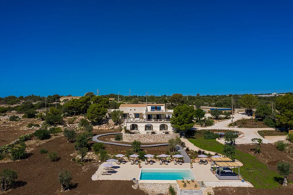 RoccaSeta Dimore Siciliane — Located on Sicily's south-east coast, not far from the sandy beaches of Sampieri, RoccaSeta offers a rustic-chic country house atmosphere. The terraced gardens provide far-reaching sea views, creating a tranquil and picturesque environment for relaxation and contemplation.
