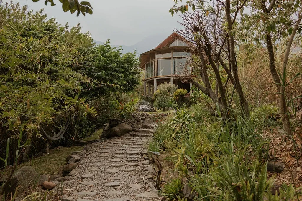 Saasil Retreat — Saasil Retreat is situated in Tzununa, Guatemala, with the serene Lake Atitlan as its backdrop. The center is enveloped by lush gardens and the gentle flow of the Tzununa River, creating an atmosphere of peace and natural beauty. The environment encourages a deep connection with nature, offering a tranquil escape from daily life.