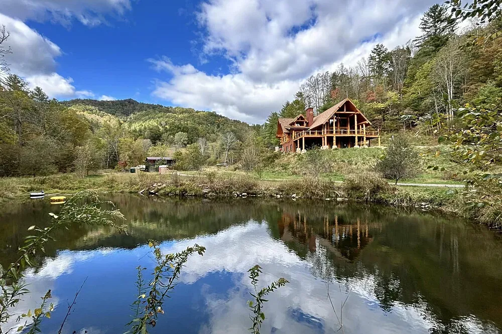 Sacred Mountain Waters Wellness Sanctuary — The sanctuary is set amidst 200 acres of North Carolina mountains, with two miles of pristine rivers forming its boundary. This natural environment offers ample opportunities for wildlife immersion, camping, and hiking, creating a peaceful and restorative atmosphere.