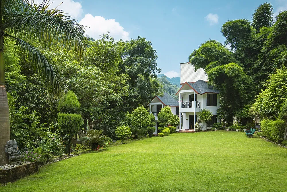 Sattva Retreat — Perched in the majestic Himalayan foothills, the retreat is surrounded by natural beauty, offering a peaceful and inspiring environment. The air is crisp, and the views are expansive, providing a perfect backdrop for introspection and relaxation, just 30 minutes outside the spiritual hub of Rishikesh.