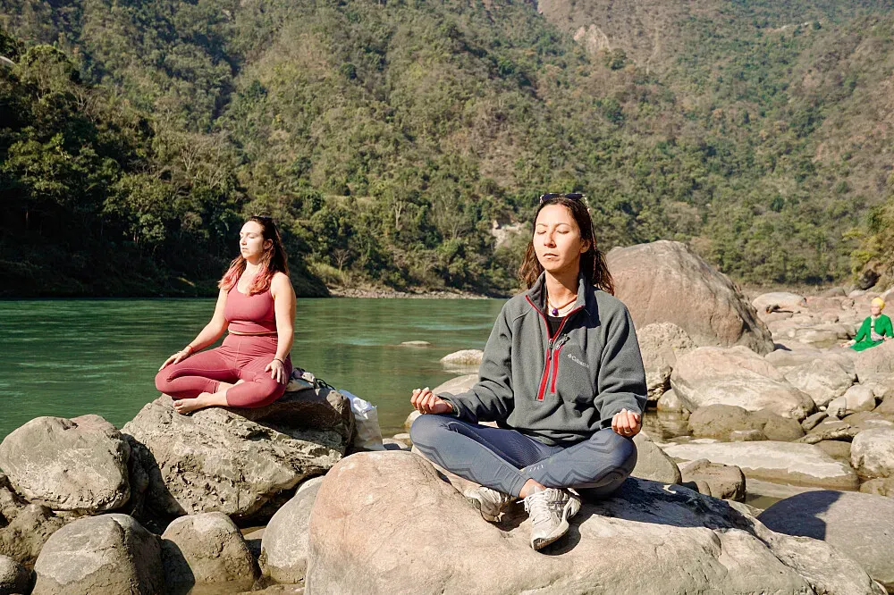 Satya Yoga Ashram Rishikesh, India — set in the spiritual city of Rishikesh, the ashram is surrounded by the natural beauty of the Himalayan foothills. The environment encourages introspection and connection with nature, offering a tranquil escape from the bustle of everyday life. The sacred Ganges River flows nearby, adding to the area's profound spiritual energy.