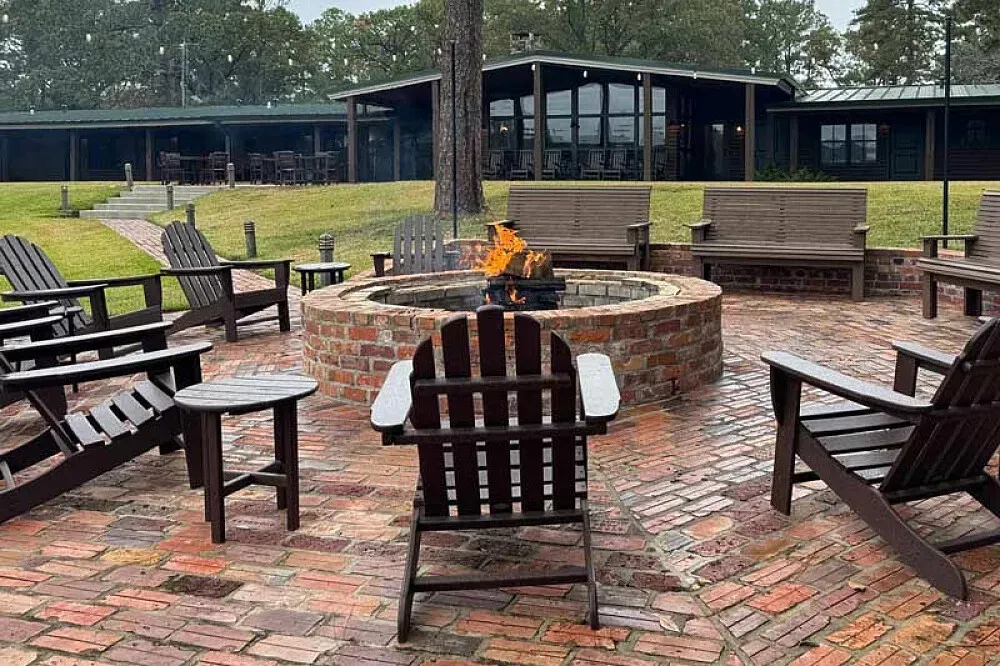 Scrappin' Valley Lodge — The lodge is situated in the heart of the Piney Woods, suggesting a natural and peaceful environment. The atmosphere likely balances rustic charm with modern comforts, providing a relaxing backdrop for any gathering.